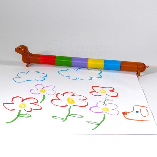 Image showing the Rainbow Dachshund Markers all together in front of a flower drawing