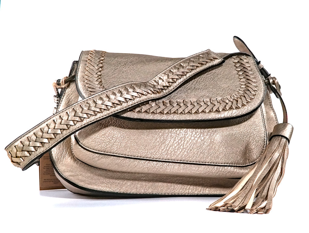 Copper vegan leather handbag with braided detail on a white background