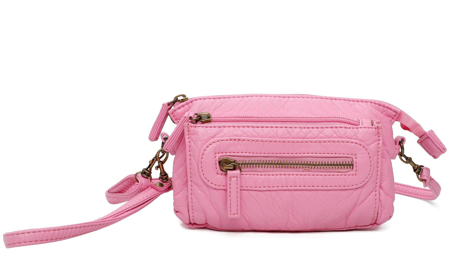 Pink crossbody bag with zippers on a white background