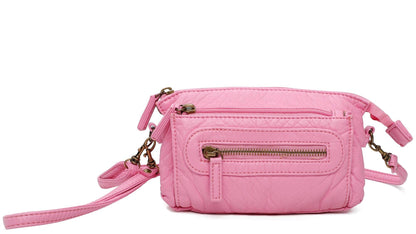 Pink crossbody bag with zippers on a white background