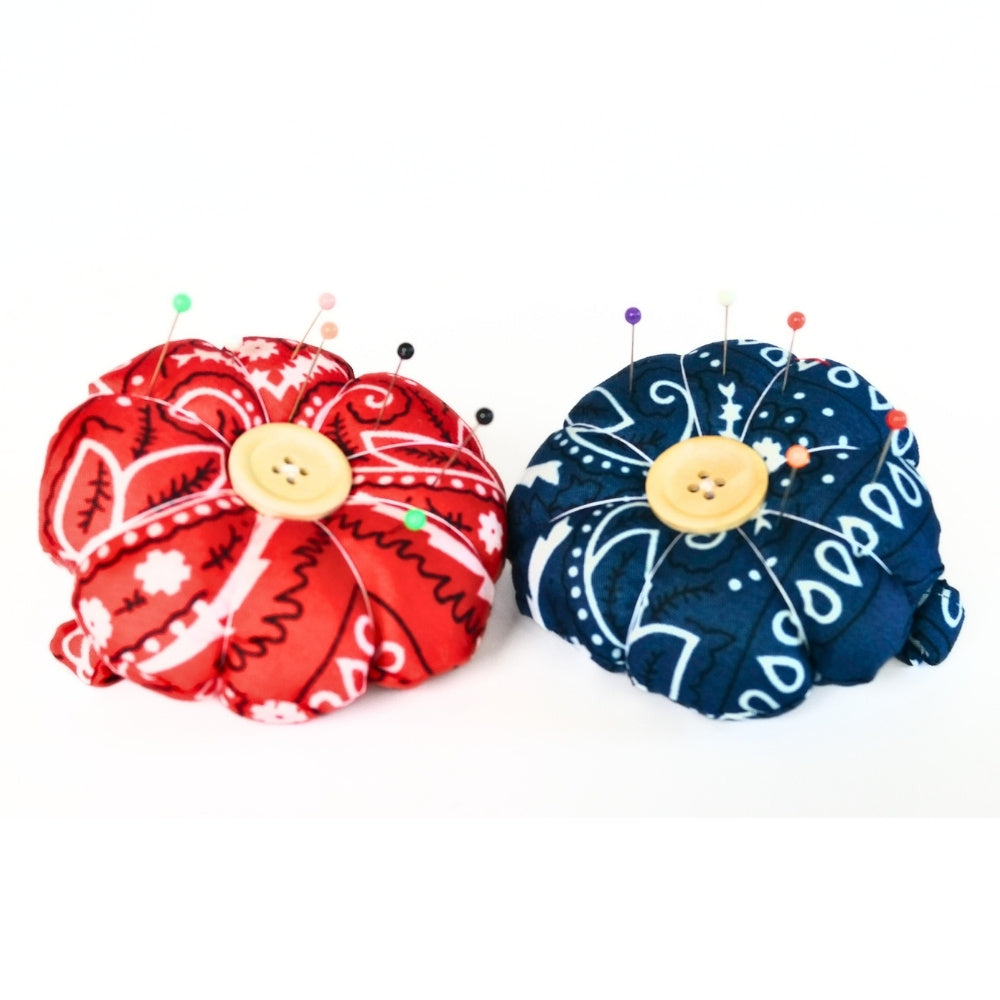 A red and blue finished Flower Pin Cushion Wristband DIY kits.