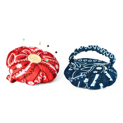 Finished Flower Pin Cushion Wristband viewed from the top (red) and back (blue). 