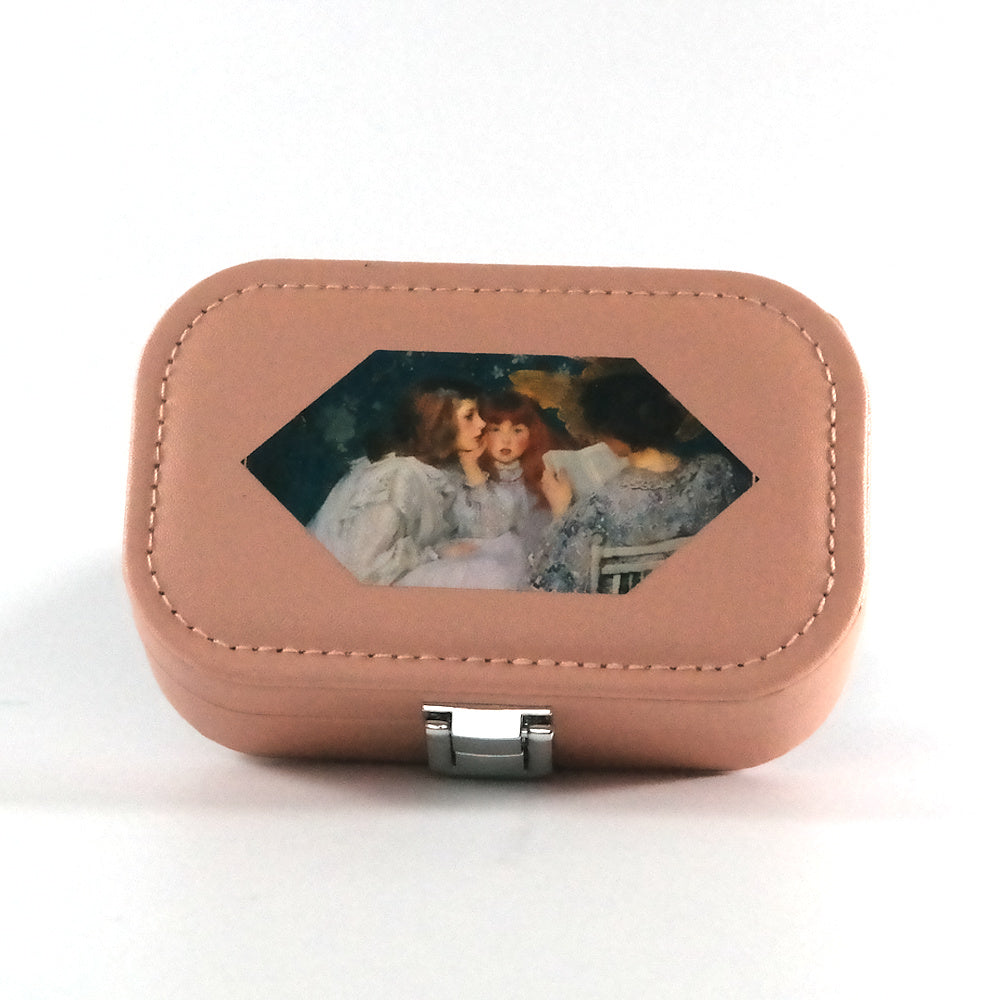 Brown jewelry box with a decorative panel featuring three women on a white background
