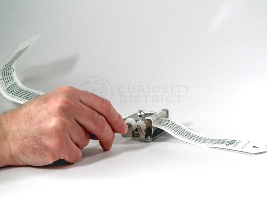 Hand Moving the crank of the DIY Make Your Own Music Box Kit