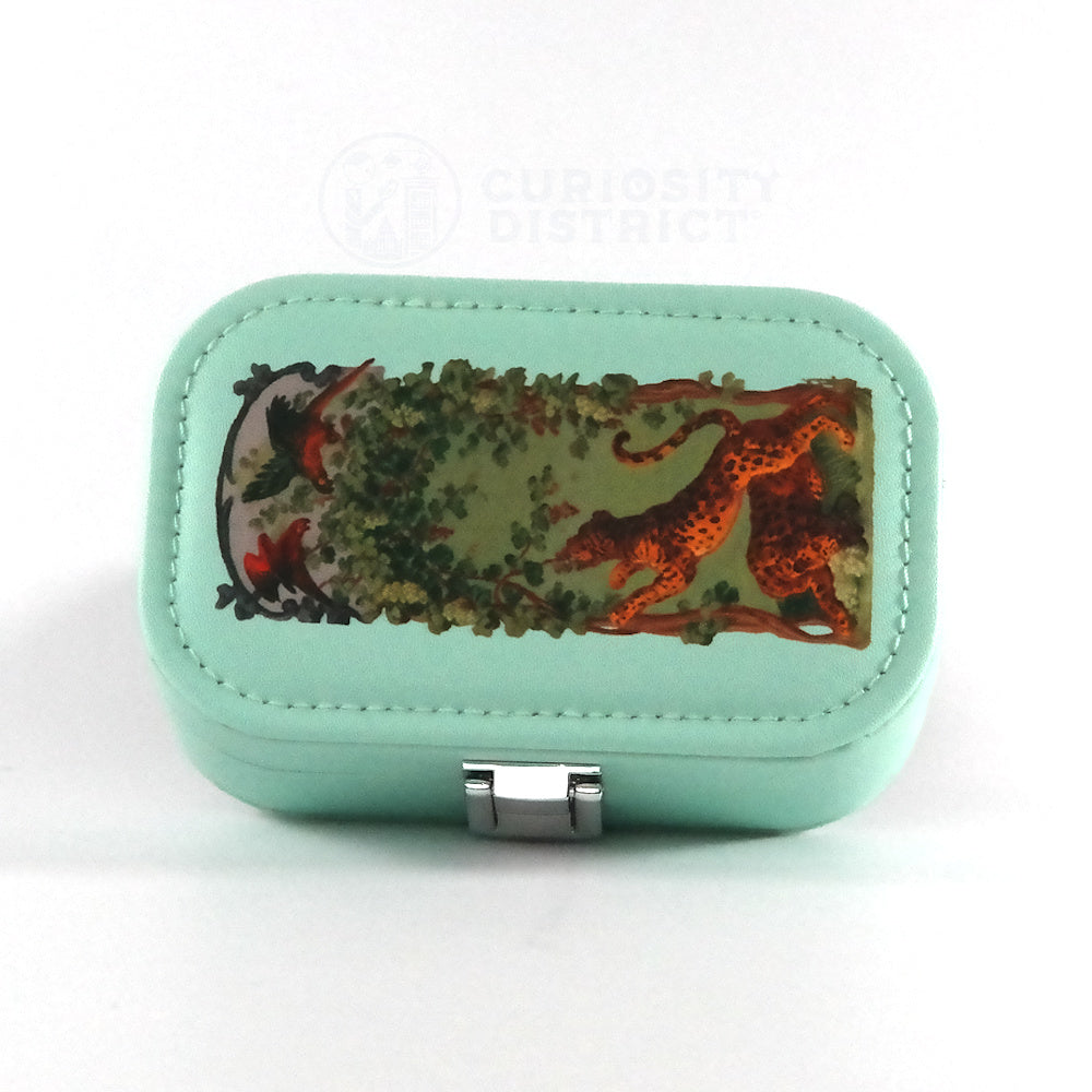 Mint green jewelry box with nature-themed design on a white background