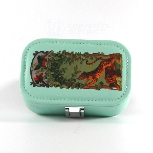 Mint green jewelry box with nature-themed design on a white background