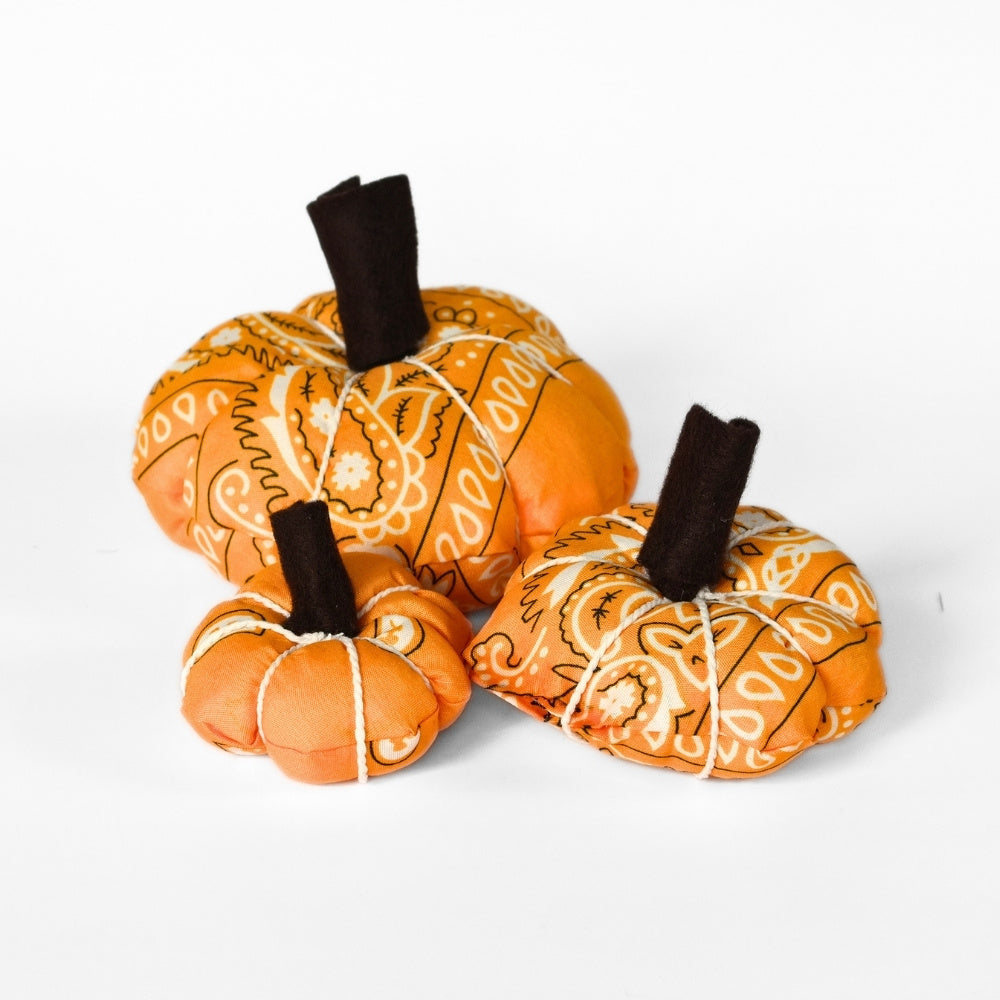 Large, medium, and small orange bandana pumpkins made from one bandana for handmade fall décor