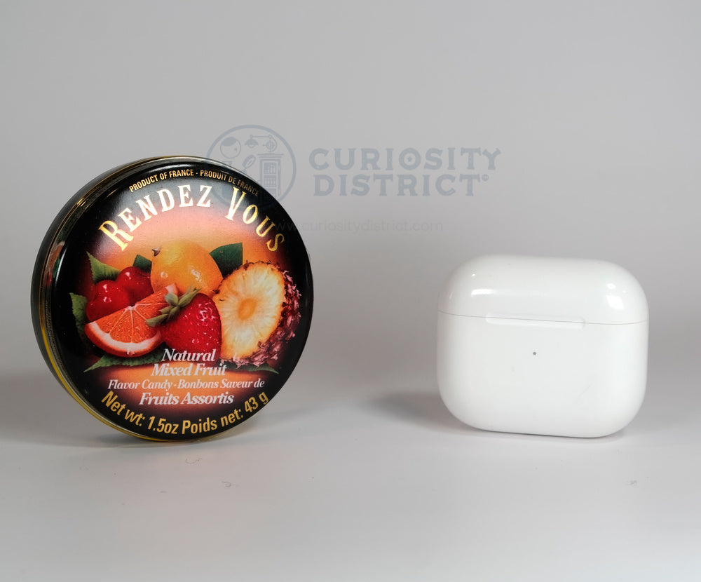 Renderez Vous Natural Mixed Fruit Flavor Candy Tin size comparison with Earpods Case