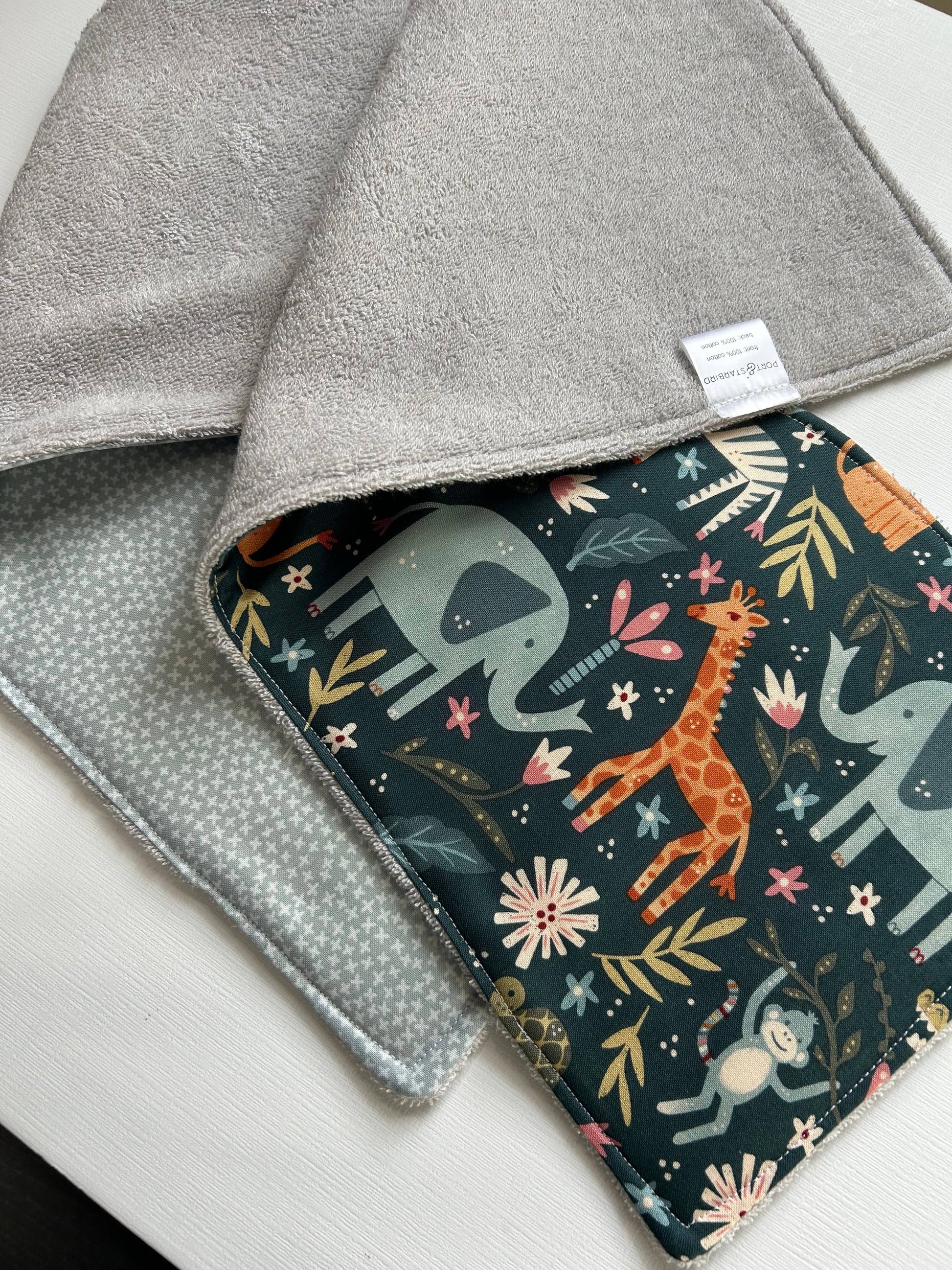 Image of the two Signature Burp Cloth with Jungle design, showing front and back. 