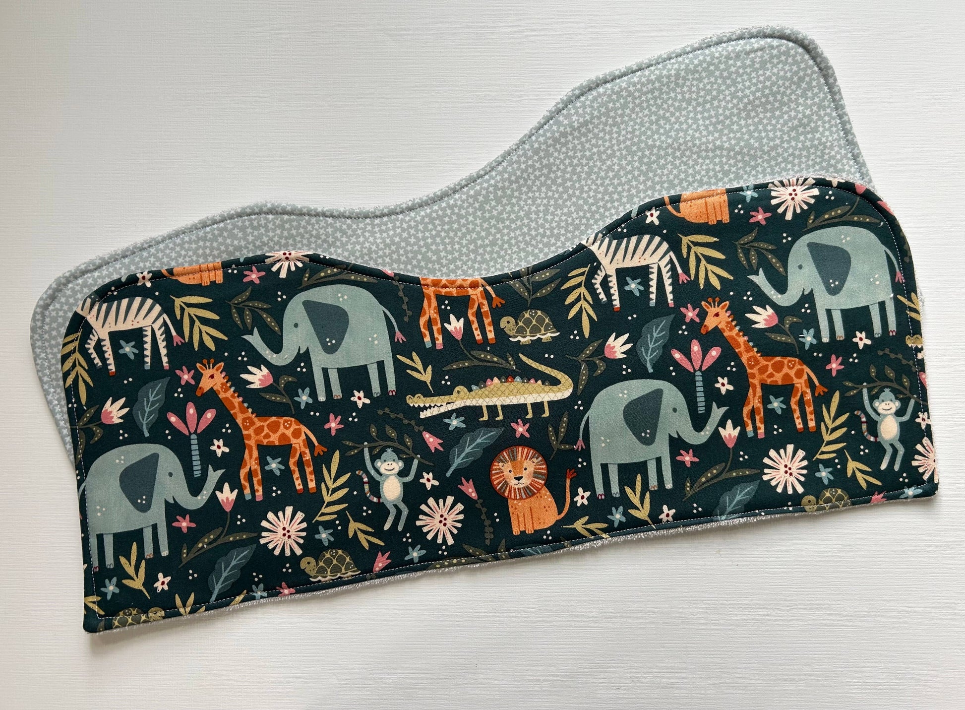 Image of the two Signature Burp Cloth with Jungle design, extended. 