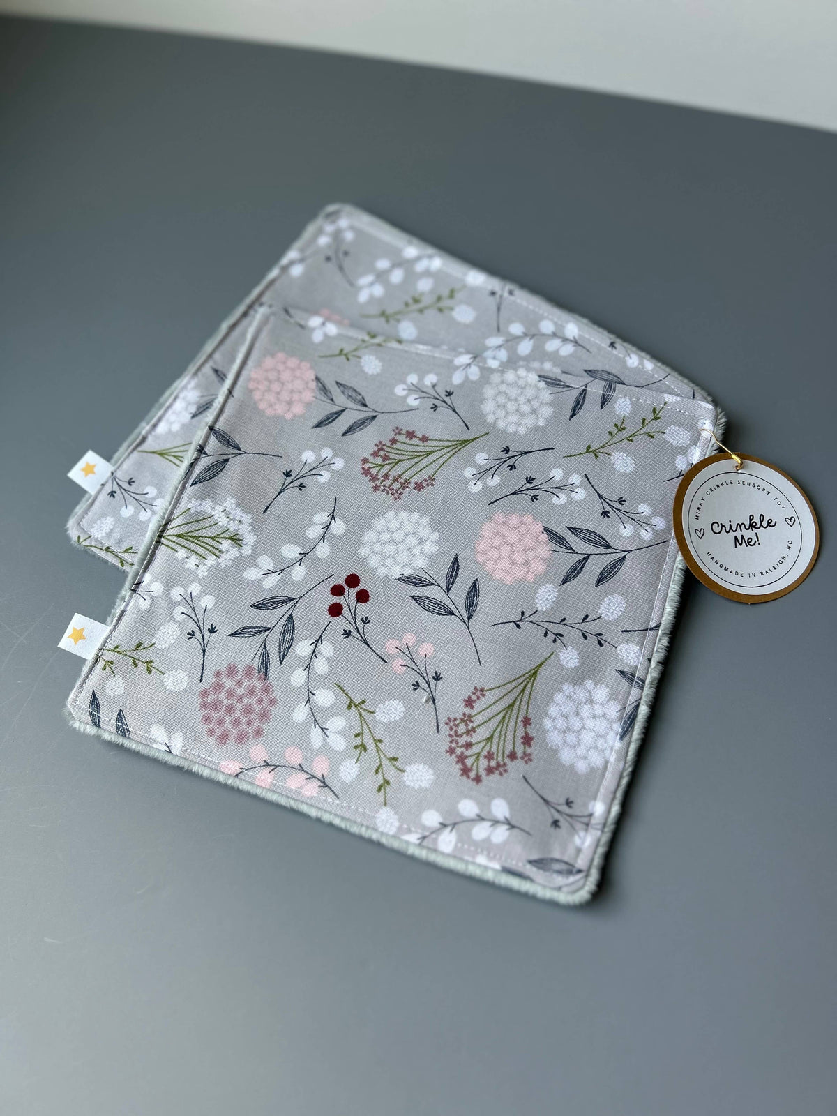 Front view of the Signature Minky Crinkle Sensory Toy, Grey Wildflowers design