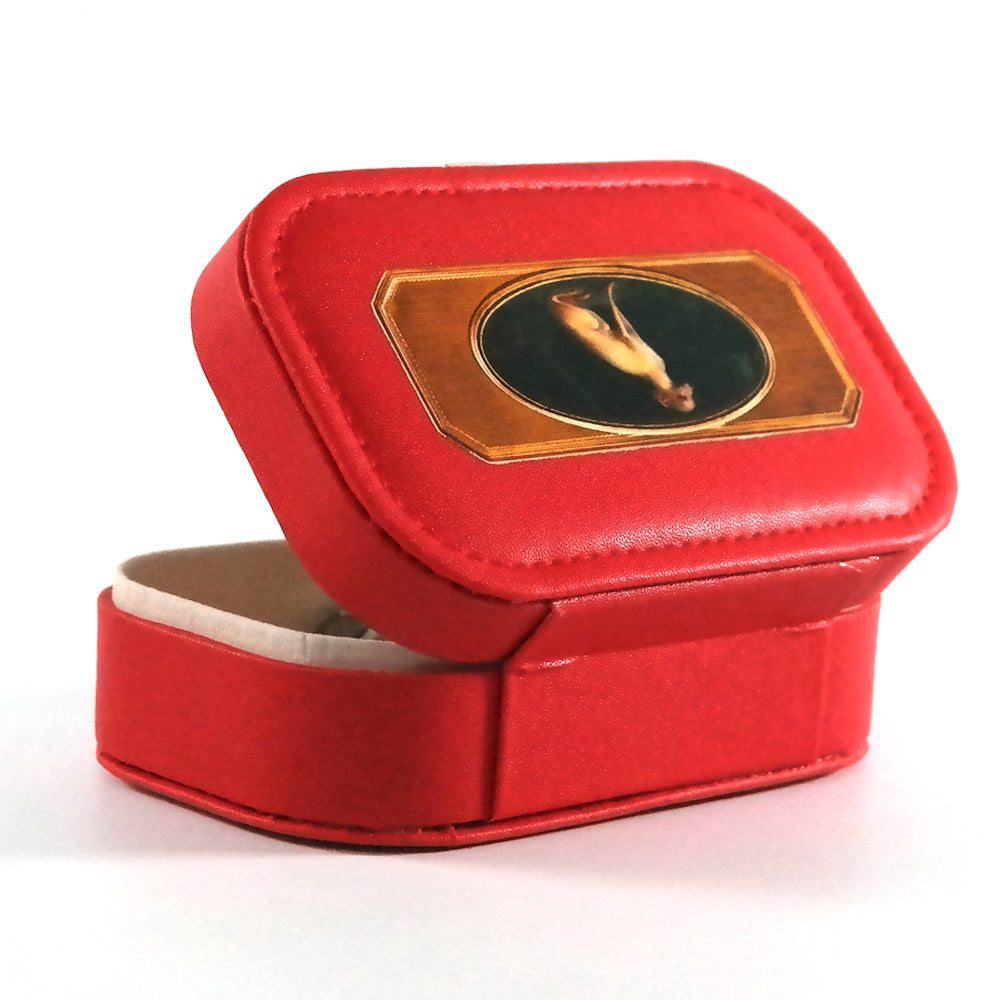 Miniature red jewelry box with a button closure and the portrait of a whippet, pictured from the back. 